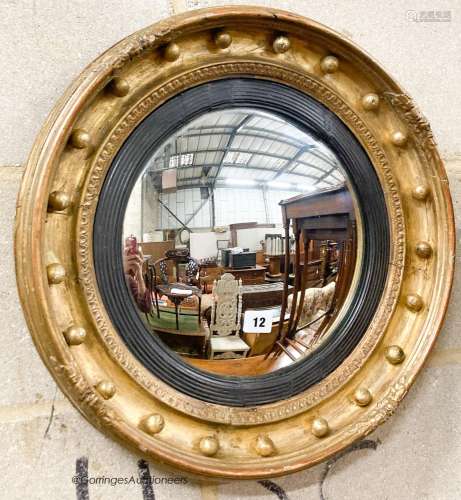 A Victorian giltwood and gesso convex wall mirror, diameter ...