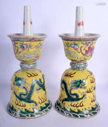 A PAIR OF 19TH CENTURY CHINESE FAMILLE JAUNE PRICKET CANDLES...