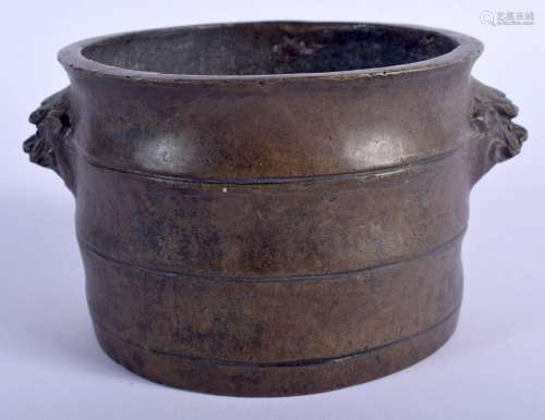 A CHINESE BRONZE CENSER 20th Century, decorated with mask he...