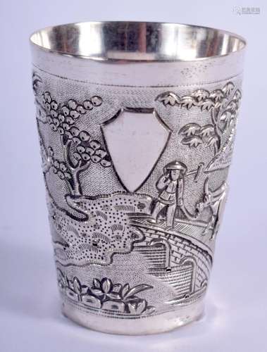 A 19TH CENTURY INDIAN SILVER BEAKER decorated with landscape...