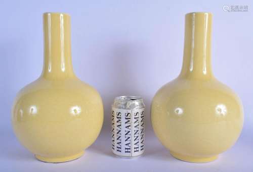 A PAIR OF EARLY 20TH CENTURY CHINESE YELLOW GLAZED BULBOUS V...
