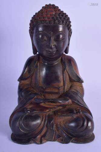 A CHINESE TIBETAN BRONZE FIGURE OF A SEATED BUDDHA 20th Cent...
