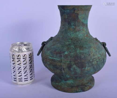 A CHINESE QING DYNASTY BRONZE FORM HU VASE modelled in the a...