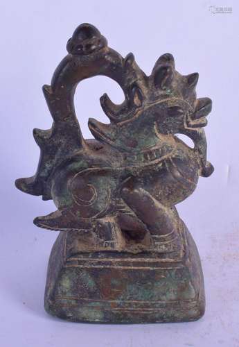 AN 18TH/19TH CENTURY BURMESE BRONZE OPIUM WEIGHT modelled as...