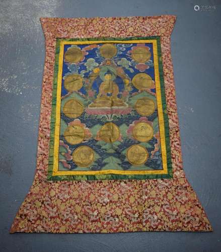 A 19TH CENTURY CHINESE TIBETAN PAINTED SILK THANGKA decorate...