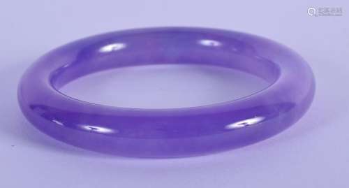 A 20TH CENTURY CHINESE CARVED ICY LAVENDER BANGLE . 8cm Diam...