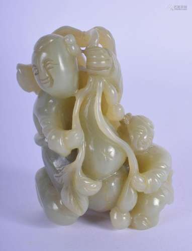 A 2TH CENTURY CHINESE GREEN JADE CARVING OF A MAN AND BOY. 7...