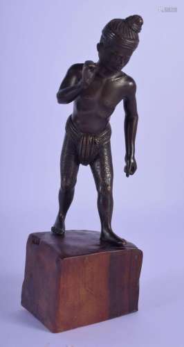 A 19TH CENTURY INDIAN BURMESE BRONZE FIGURE OF A MALE modell...