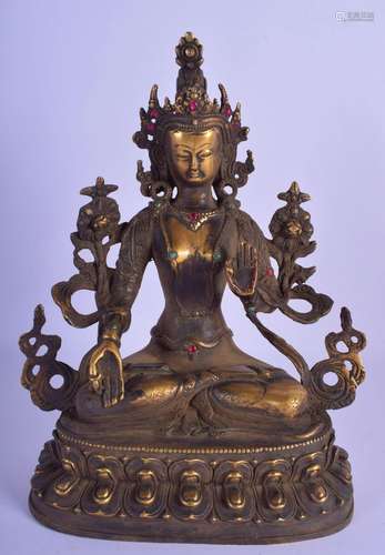 A CHINESE TIBETAN GILT BRONZE JEWELLED FIGURE 20th Century. ...