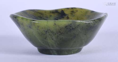 A 19TH CENTURY CHINESE CARVED SPINACH JADE SCALLOPED TEABOWL...