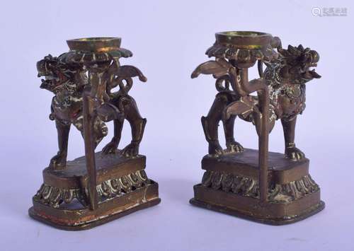 A PAIR OF 19TH CENTURY SOUTH EAST ASIAN BRONZE CANDLESTICKS ...