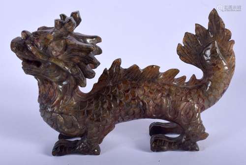 AN EARLY 20TH CENTURY CHINESE CARVED BLOOD MUTTON JADE DRAGO...