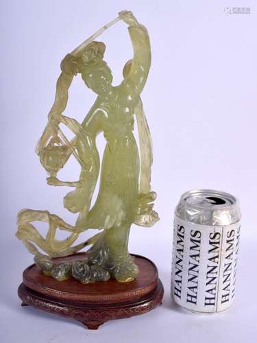 AN EARLY 20TH CENTURY CHINESE CARVED JADE FIGURE OF AN IMMOR...