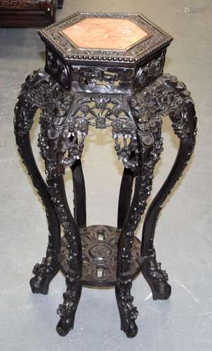 A 19TH CENTURY CHINESE CARVED HARDWOOD AND MARBLE STAND Qing...