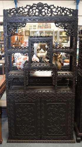 A 19TH CENTURY CHINESE CARVED HARDWOOD HONGMU DISPLAY CABINE...