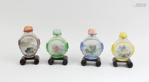 A Group of Four Peking Glass Snuff Bottles