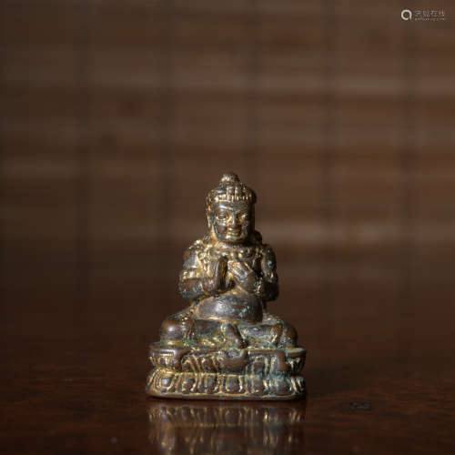 A gilt-bronze statue of Pharmacist Buddha