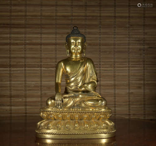 A gilt-bronze statue of Sakya Mani