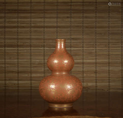 An allite red glazed bottle painting in gold
