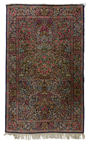 An Oriental Kirman woollen rug, floral decorated, 151