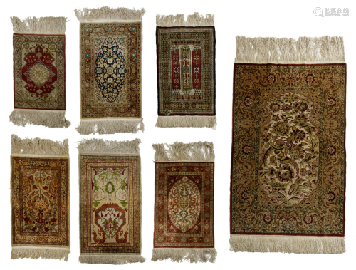 A collection of seven Oriental silk carpets, of