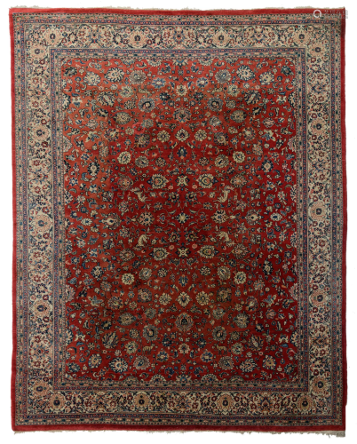 A large Oriental Sarourg carpet, floral decorated with