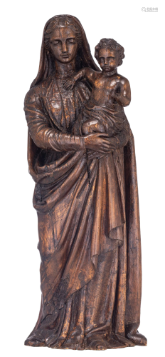 An imposing sculpture of the Madonna holding the Holy