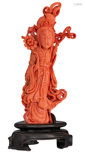 A Chinese finely carved red coral figure depicting a