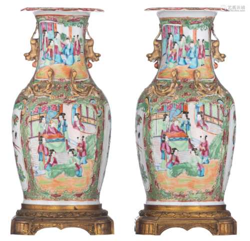 A pair of Chinese Canton vases, with fixed gilt bronze