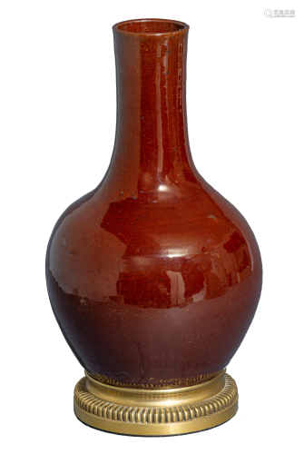 A Chinese sang-de-boeuf bottle vase, with a gilt