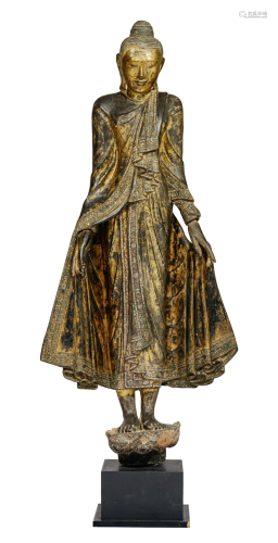 An extremely rare gilt and lacquered wood standing