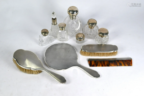 Silver four-piece dressing table set & scent bottles
