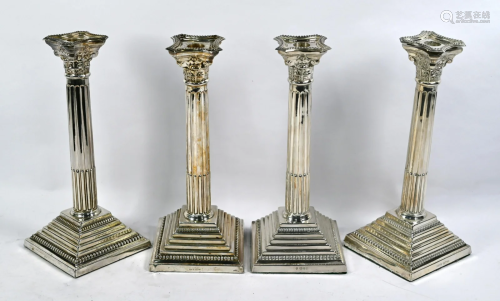 Two pairs of silver classical column candlesticks