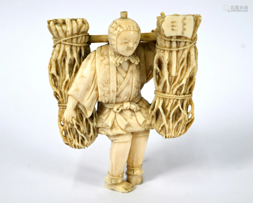 A 19th century Japanese ivory okimono of a wood