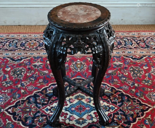 An antique Chinese carved rosewood stand