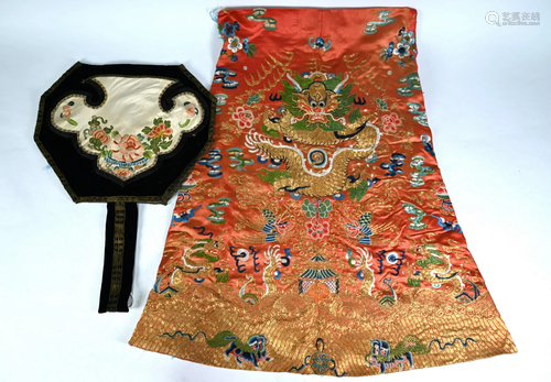 A Chinese embroidered silk faded-red ground dragon robe