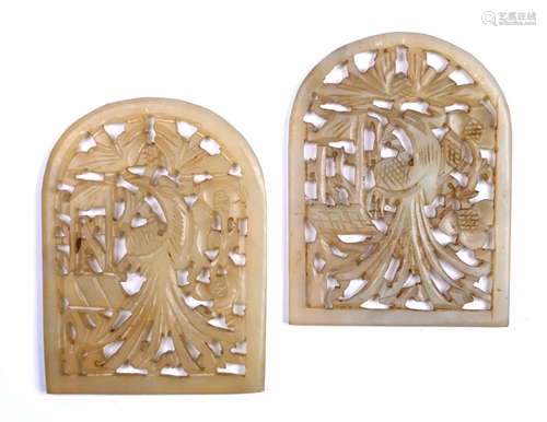 A pair of Chinese jade arched amulets carved with