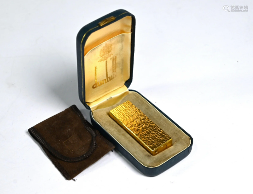 A Dunhill gilt metal textured brick cigarette lighter