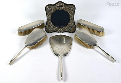 Silver five-piece brush set and photograph frame