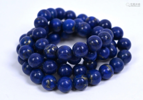 A single row of uniform lapis lazuli beads