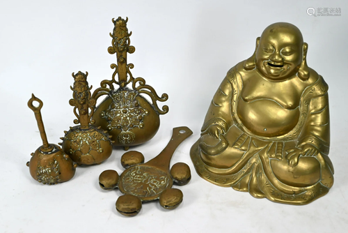 A large brass Budai figure and four Tibetan hand bells