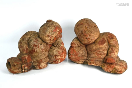 A pair or South East Asian carved hardwood and red