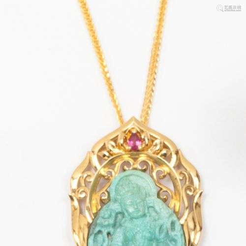 Pendentif « Bouddha » en turquoise réagglomérée dans un ento...