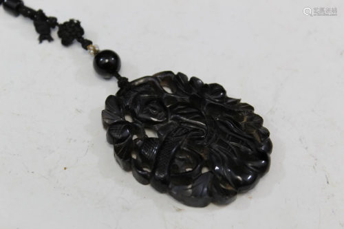 Black jade pendant.