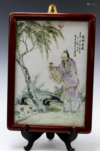 Chinese Framed Porcelain Plaque of Man holding a Lotus