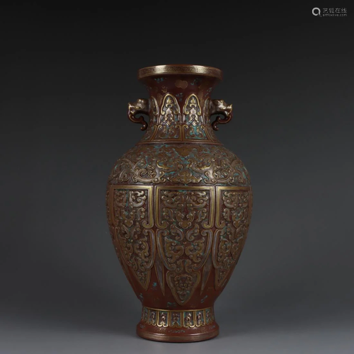 AN IMITATION BRONZE BEAST-HANDLES PORCELAIN VASE