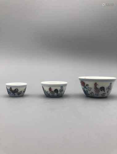 A SET OF THREE PORCELAIN CHICKEN CUPS