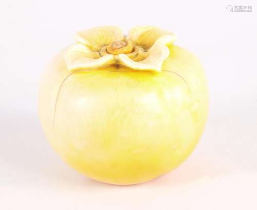 † A LATE 19TH CENTURY STAINED CARVED IVORY PERSIMMON FRUIT