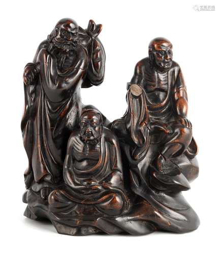 AN EARLY CHINESE CARVED HEAVY HARDWOOD FIGURAL SCULPTURE