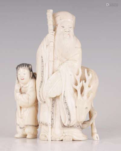 † A FINELY CARVED CHINESE IVORY SCULPTURE